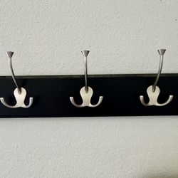 This is a BirdRock Home 5-Hook Wall Hanger with a black finish and satin nickel hooks