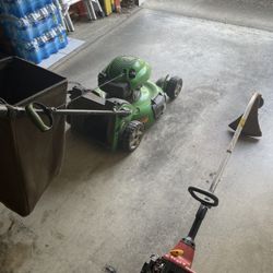Self-propelled gas powered lawnmower with bag catcher and gas powered Weedwhacker