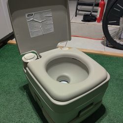 Camco Portable Travel Toilet | Features Bellow-Type Flush and Sealing Slide Valve to Lock-in Odors 2.6 Gallon (41531),Gray/Beige

