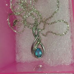 Sterling Silver Chain And Charm With Blue Topaz And Diamonds