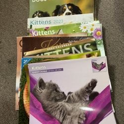 14 KITTEN. CAT. DOG CALENDARS. USED BUT PICTURES ARE GREAT