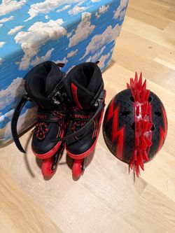 ROLLERBLADES & HELMET, for a small boy, maybe 5-6; cross streets are Arapaho & Waterview