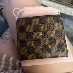 Louis Vuitton Damier Ebene wallet.
