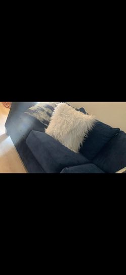 Blue Couches With White Fur Pillows
