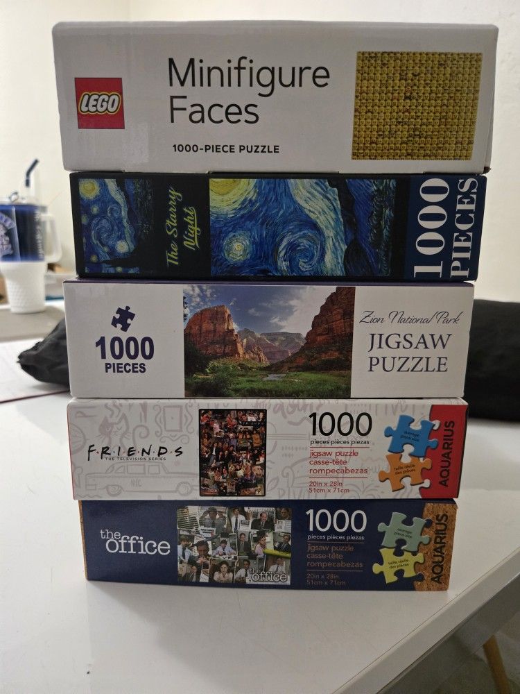 Assorted Puzzles And Puzzle Mat