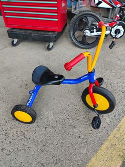 Winther Mini Viking primary tricycle features a durable, powder-coated blue steel frame with vibrant red and yellow accents recommended age between 2 