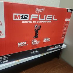 MILWAUKEE M12 FUEL 3/8" IMPACT WRENCH  COMBO BATTERY AND CHARGER  ALL NEW 
