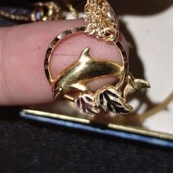 10/12K Gold Dolphin Pendant With Gold Leaves..