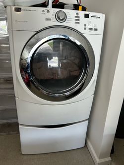 Maytag 5000 Series Front-Load Clothes Dryer with a matching Laundry Pedestal Drawer
