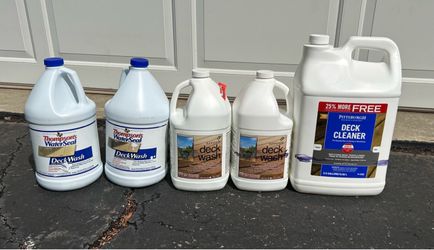 Five containers of wood deck cleaner.