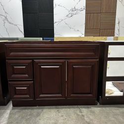 42-inch solid wood bathroom vanity, drawers can be on the left or right, 32” H × 22” D.