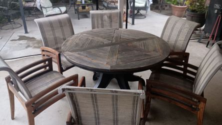 Round patio table with 6 chairs