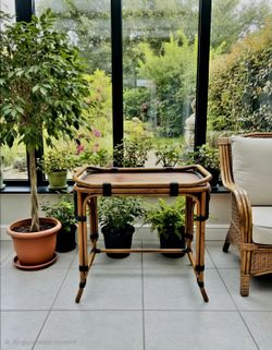 Mid-Century Modern rattan and bamboo side table, likely designed in Italy during the 1960s or 1970s. 25"×16"×24"