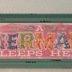   A mermaid sleeps here  Frame 