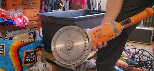 Orange Electric Angle Grinder with Cutting Disc
