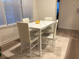Small Dining table and 4 chairs (NOT FREE)