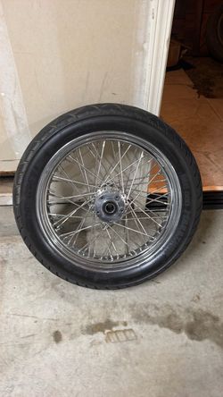 Front rim and tire off 2007 Harley street glide with dual front disc brakes