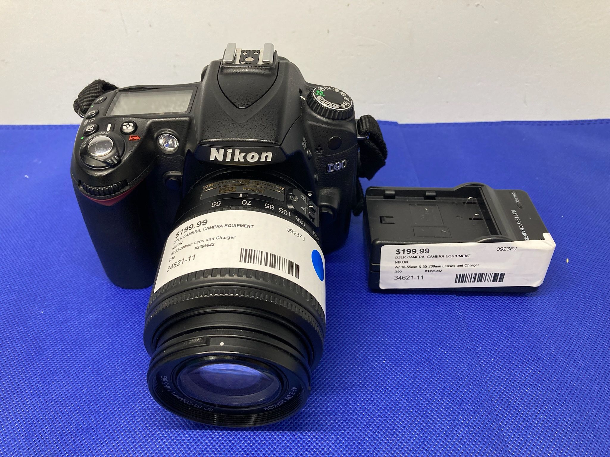 Nikon D90 DX Format CMOS Digital SLR Camera Lens and Charger