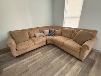 Brown couches and recliner