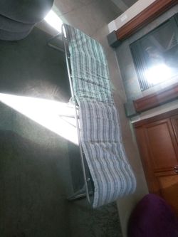 Folding cot with cushion