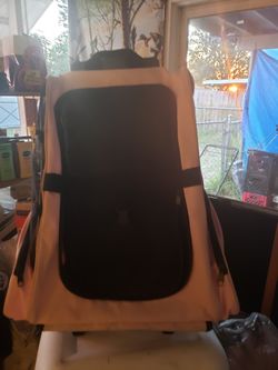 Dog Carrier With Wheels. Extended Handle. 15" toward bottom x 24" tall. Pink & Black