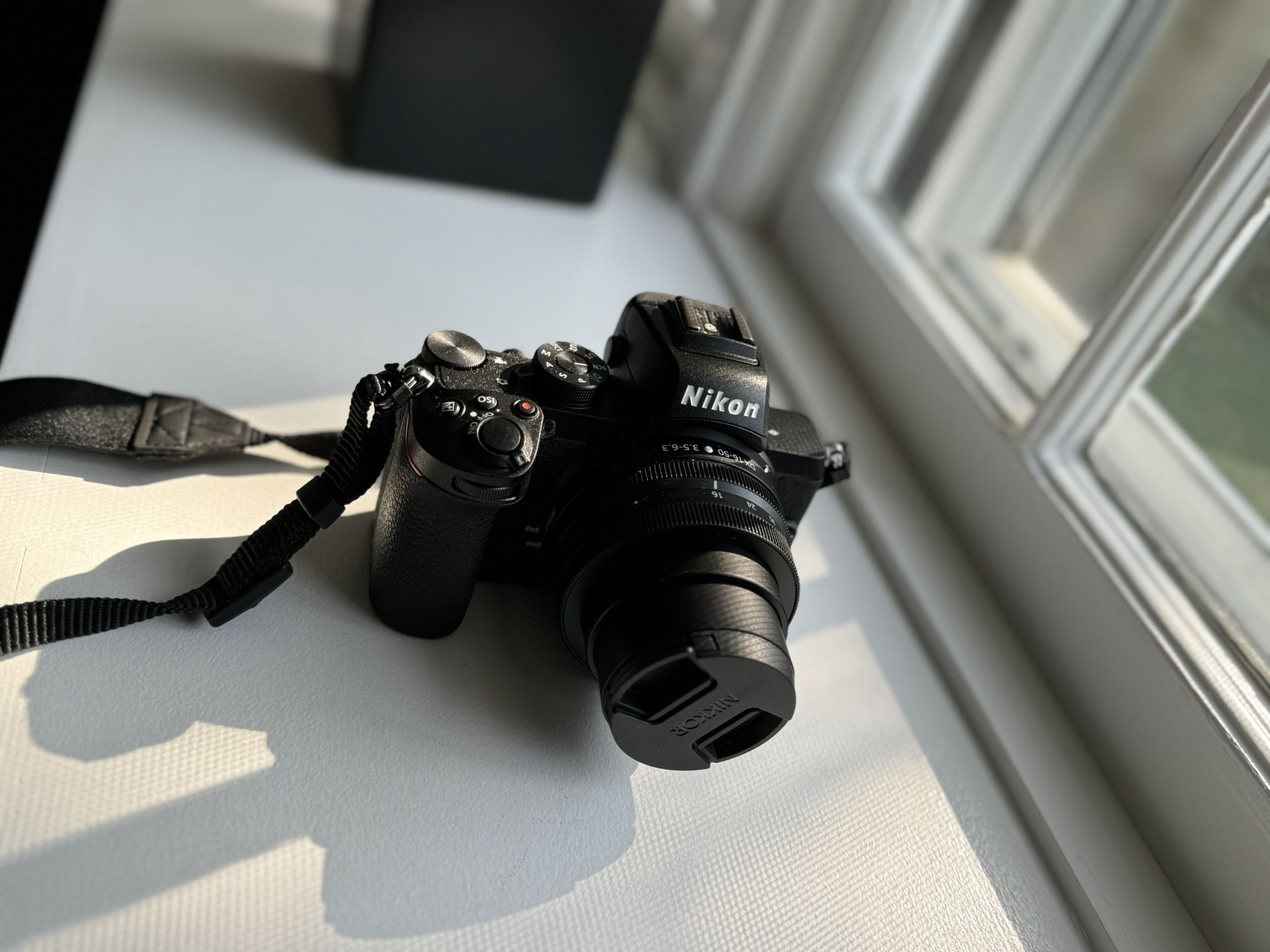 Nikon Z50 Mirrorless Camera with lens and accessories