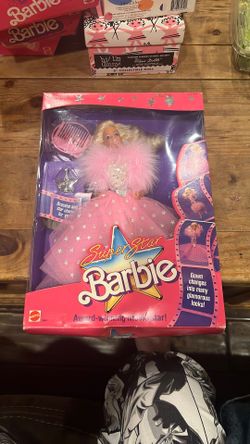 Superstar Barbie" doll from 1988, still in its original packaging. This Barbie is identified as the "Award-Winning Movie Star" version, model number 1