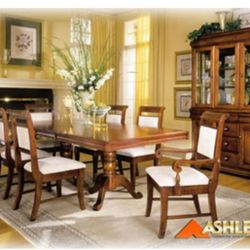 Dinning Table Cherry ,double Pedestal With 4 Side Chairs And 2 Arm Chairs ,and Table Extension. In Excellent Condition Still In Original Plastic Wrap