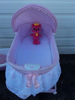 Baby's Crib with Locking Wheels and Music Made by DELTA Cribs.