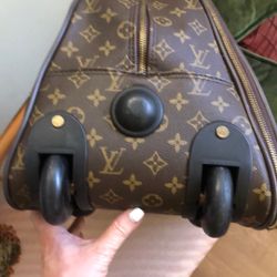 Rolling LV Traveling Bag.