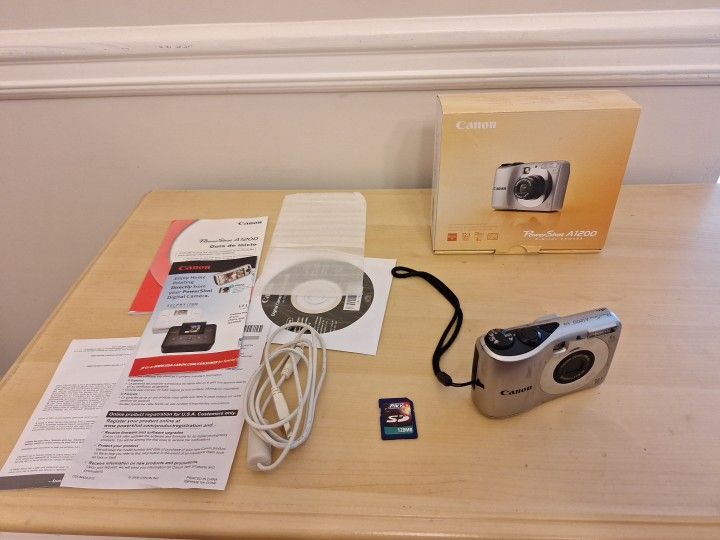 Canon Powershot A1200 12.1 Mp Camera . Box And Paper Work
