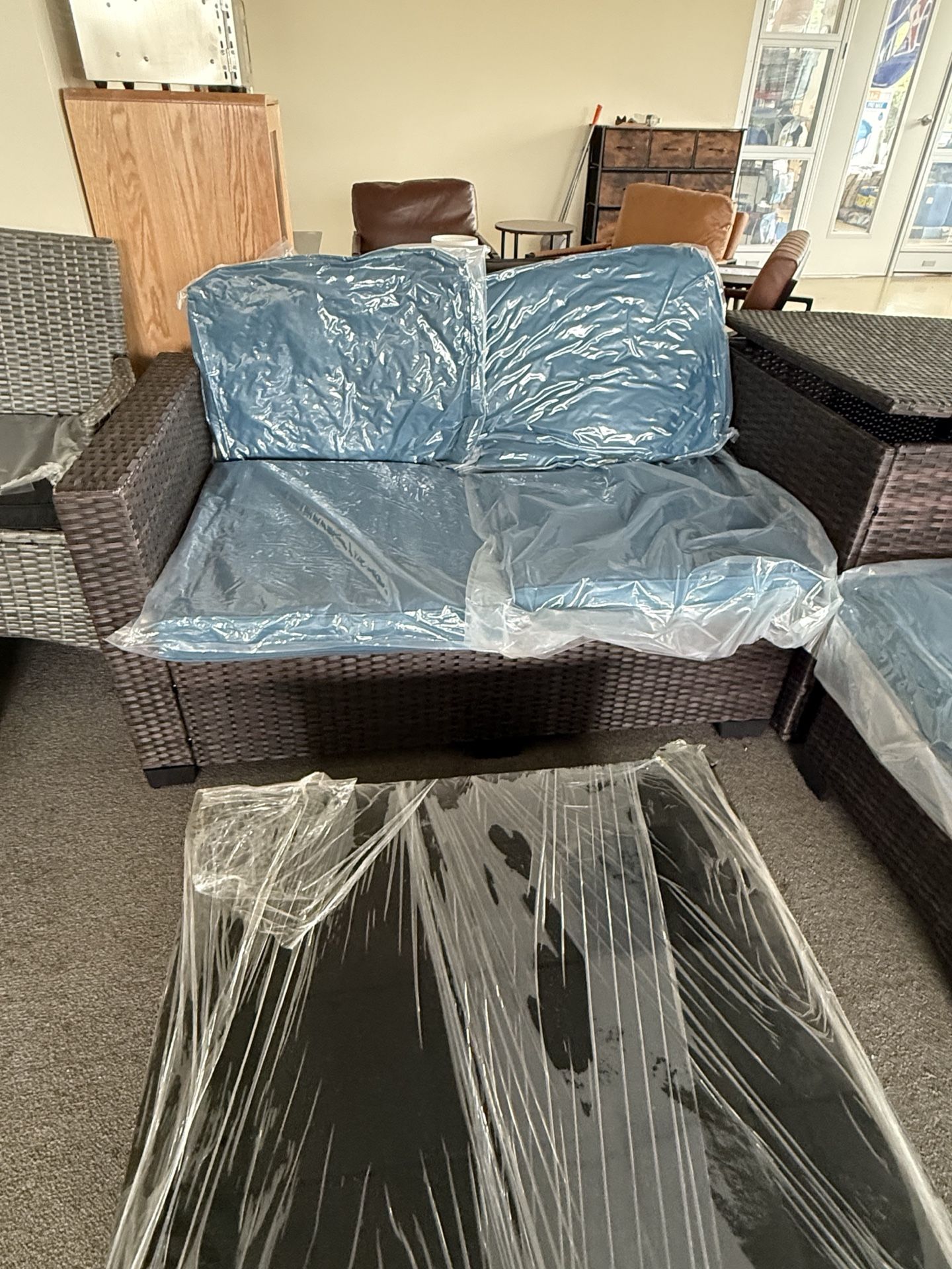 Outdoor Patio 4 pieces set with a large storage box. Tempered glass table top, brand new set with unopened cushions $550