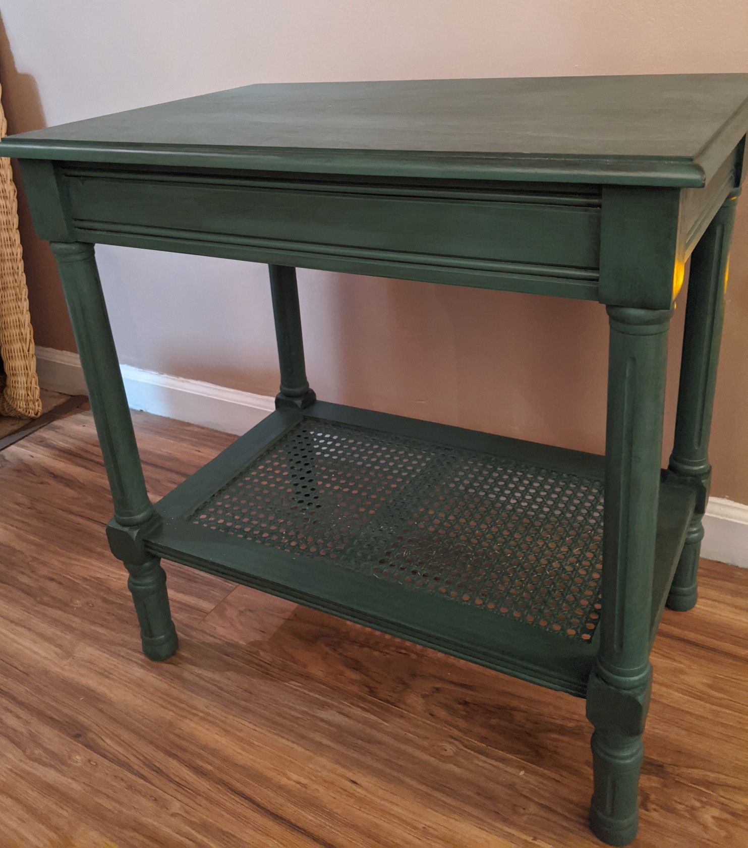 Teal distressed side table with wicker shelf