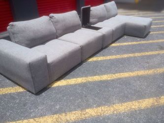 Free Delivery Today ! Cleaned ! Movie Theater Style Grey sectional couch. Bluetooth speakers with subwoofer, USB plugs and charging port, adjustable b