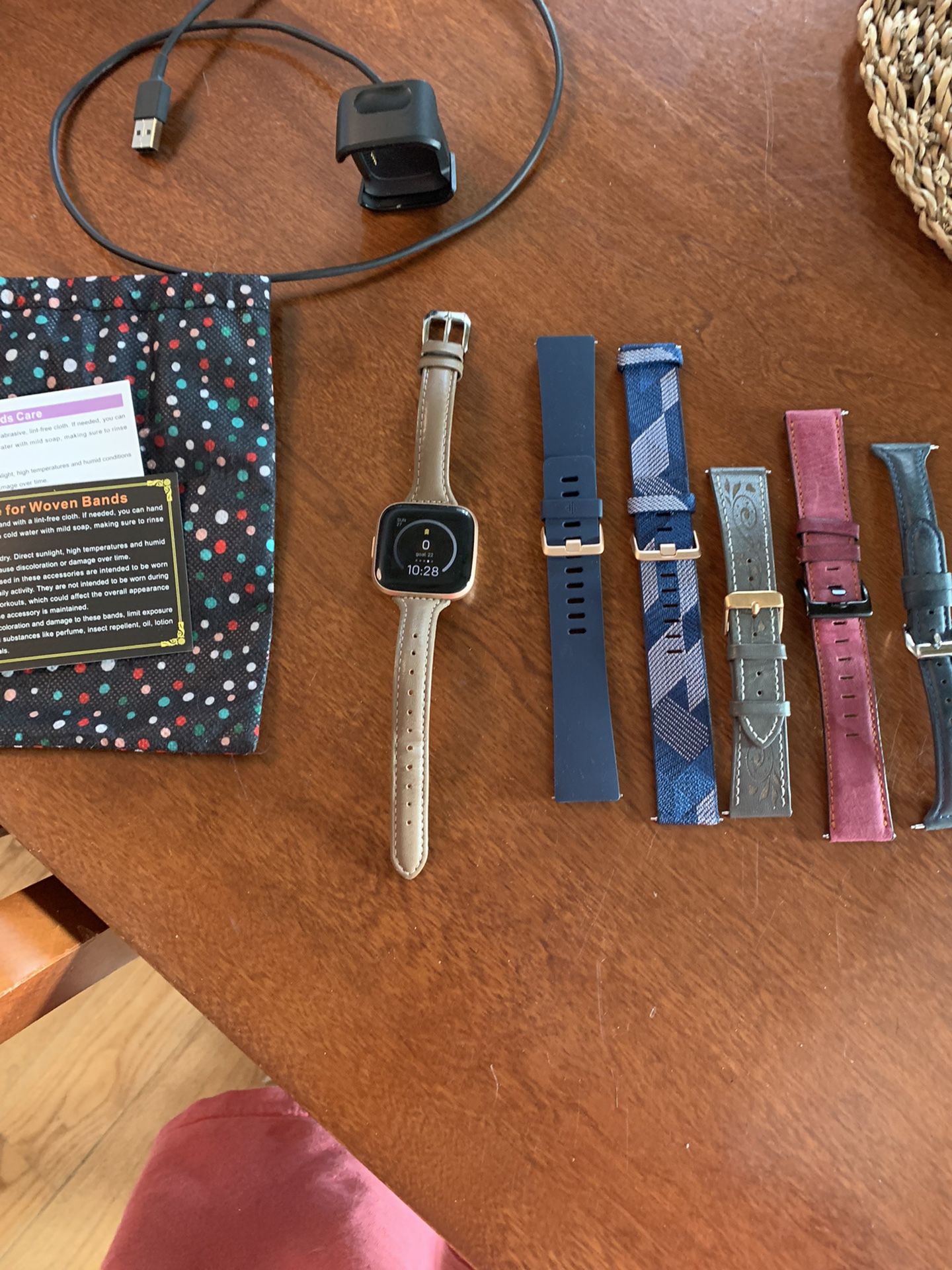 Fitbit Versa 2  With Charger, Dongle, And Many Bands.