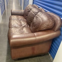 Comfortable Nailtrim Leather Couch (free delivery)