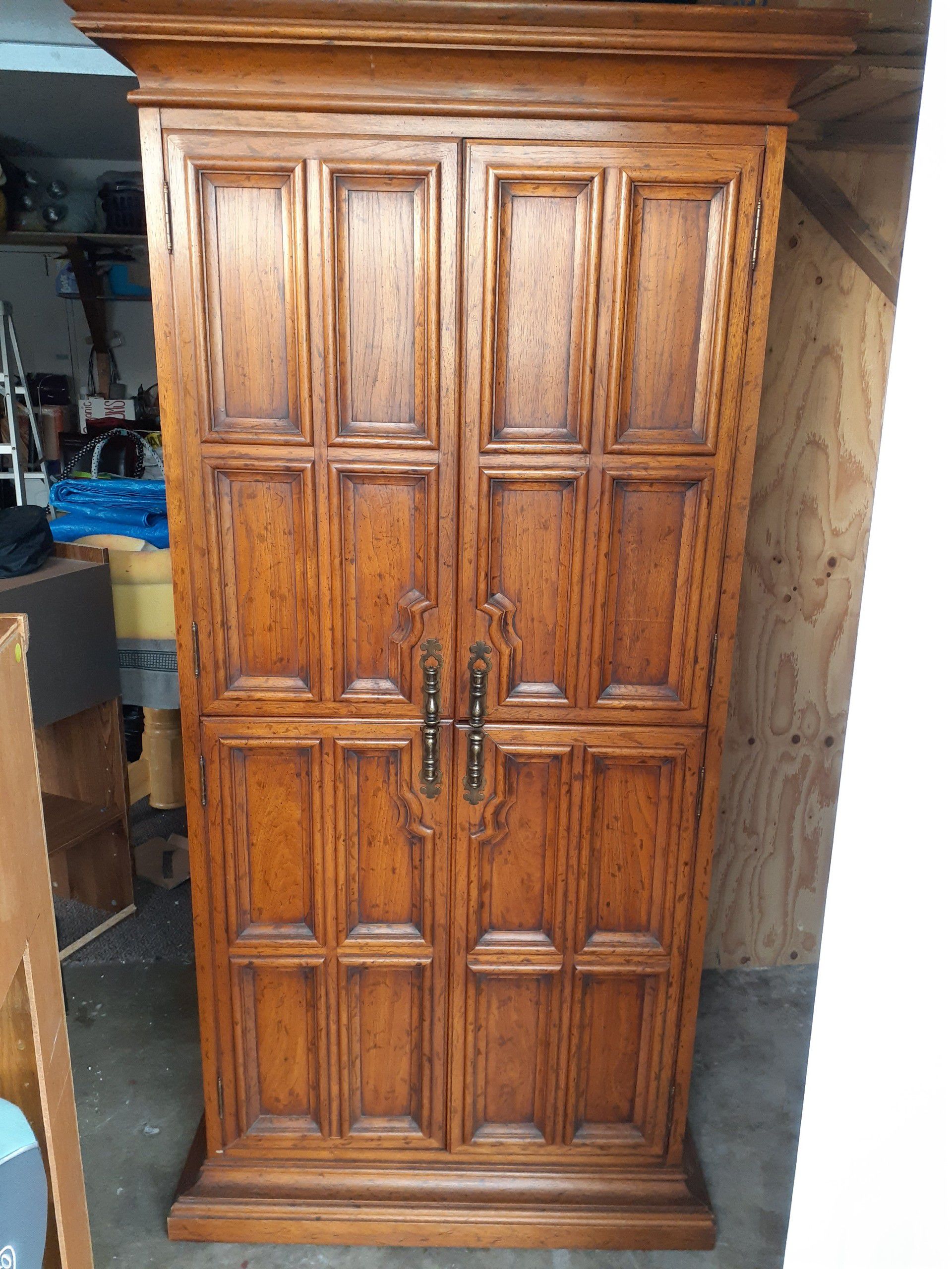 Solid wood cabinet..Dimensions are 79"h 34"w 20"d