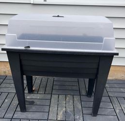 Raised garden bed with cover