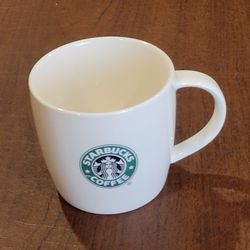 STARBUCKS 2008 White Coffee Mug Cup Green Mermaid Logo 12oz. Pre-owned, 
very good shape, please see photos for details. It is 3.5" tall, weight 
11oz
