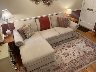 Beige Sectional Sofa with Decorative Pillows