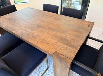 Beautiful CB2 mango wood dining table with 6 Article Oscuro dining chairs