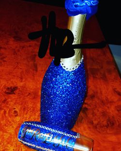 Brand New Customized Nipsey hussle prosecco set. Prosecco covered in Nipseyblue, with customized prolific wine glass.