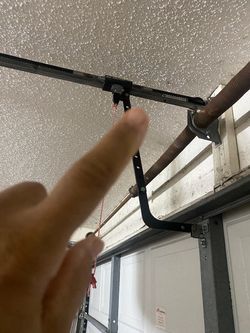 Overhead garage door broken spring opener off track adjustment replace and parts