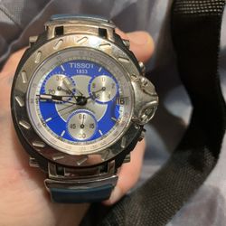 Tissot Watch Blue Band And Sapphire Crystals In The Silver Around Watch Face And Back 