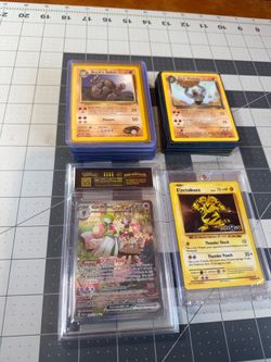 Pokemon Lot Cards. Comes with one Ungraded slab and some 1st editions and Team Rocket etc $250
