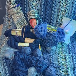 Partially Finished Afghan With Lotsa Yarn And Some Crochet Stick Thingys 