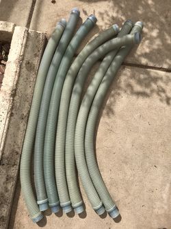 Seven blue gray used hoses for pool cleaner