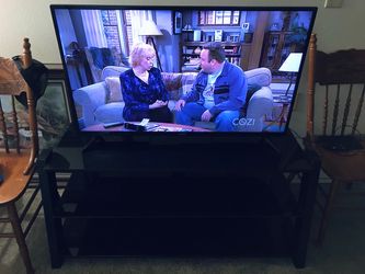 Toshiba fire TV edition 43 inch With box and Glass top entertainment center Original Owner in Great working & Looking condition