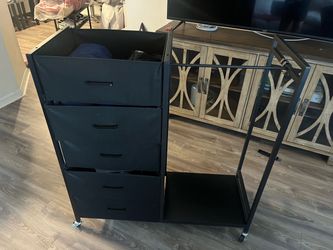 black rolling storage cart with 5 fabric drawers and the open side section