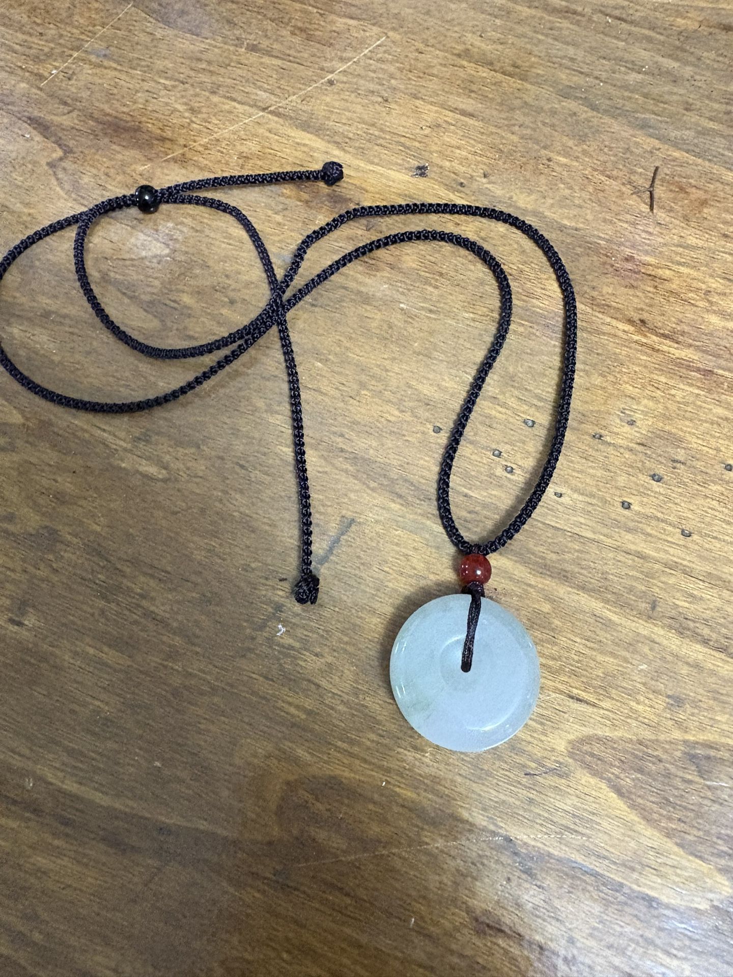 Green jadeite jade donut pendant necklace